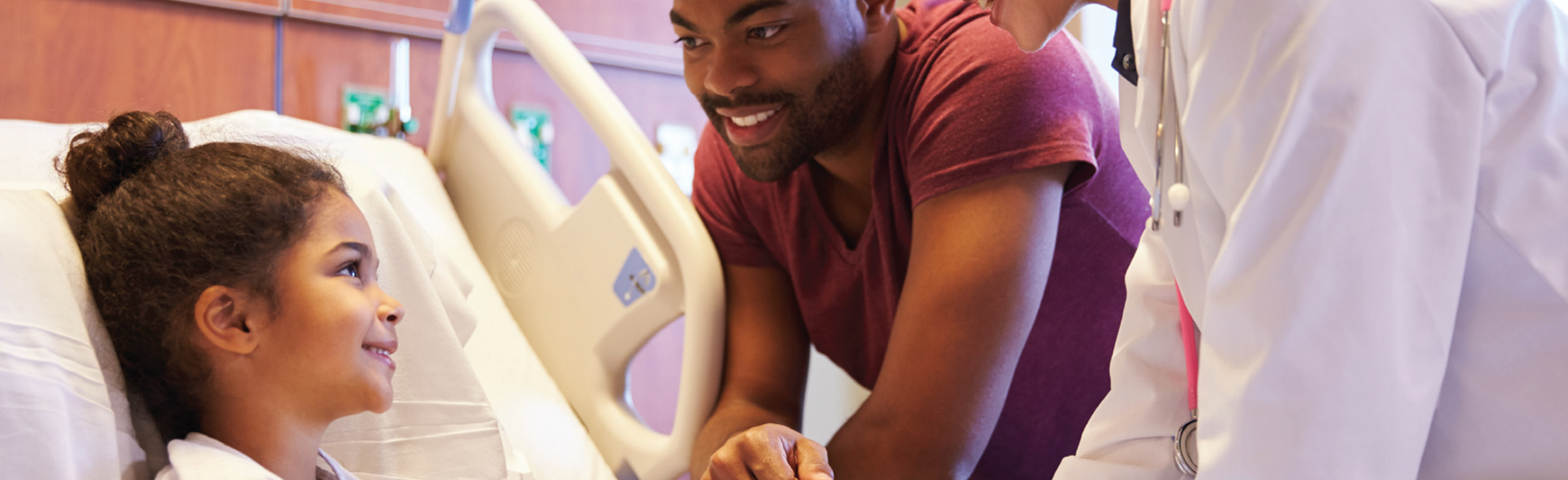 pediatric patient with clinicians at bedside